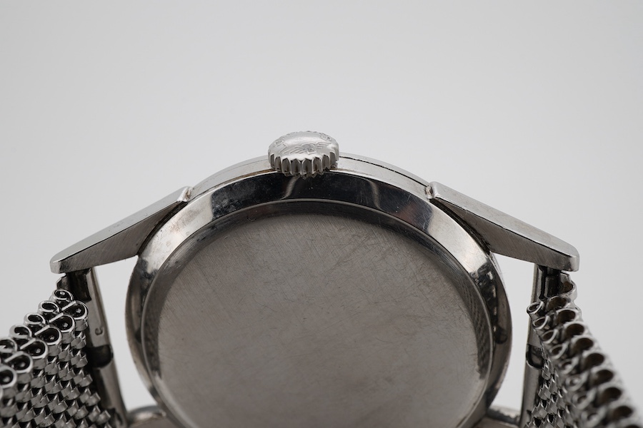 A gentleman's stainless steel Longines manual wind wrist watch, with baton and quarterly Arabic numerals and subsidiary seconds, case diameter 35mm, on an associated flexible strap.